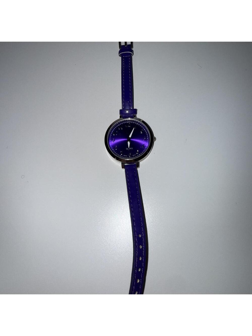 Purple leather strap watch with silver accents